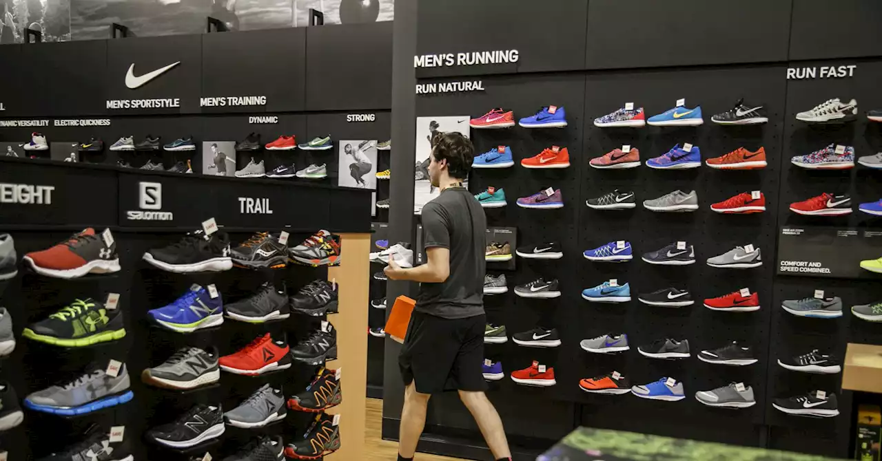 Nike shares are falling as the sneaker maker warns of a sales slowdown