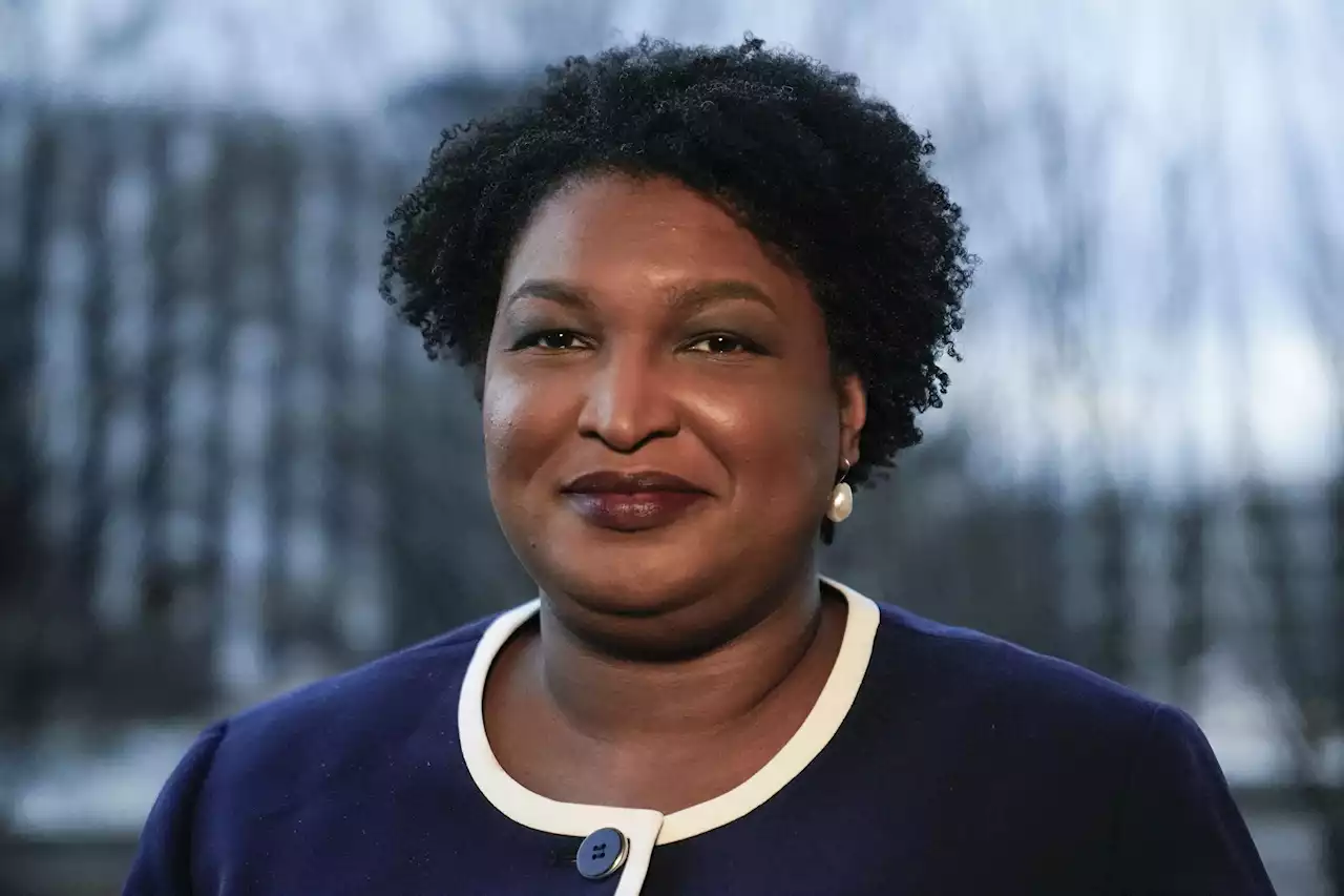 Abrams noticeably absent from Biden's voting rights push | AP News