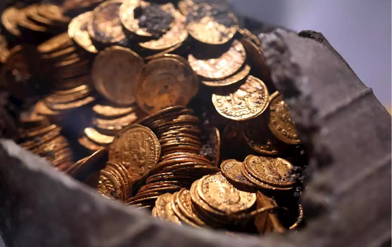 A hungry badger looking for food in a cave found a trove of ancient Roman coins instead