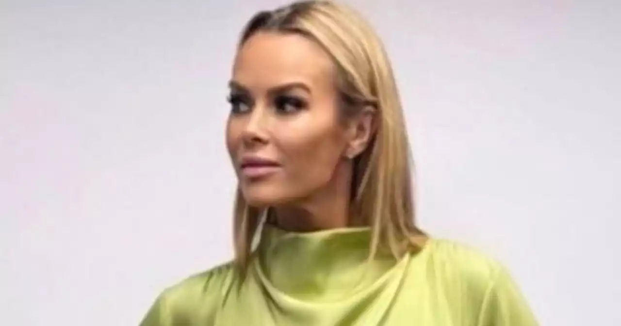 Amanda Holden goes braless and flaunts curves in silky green co-ord