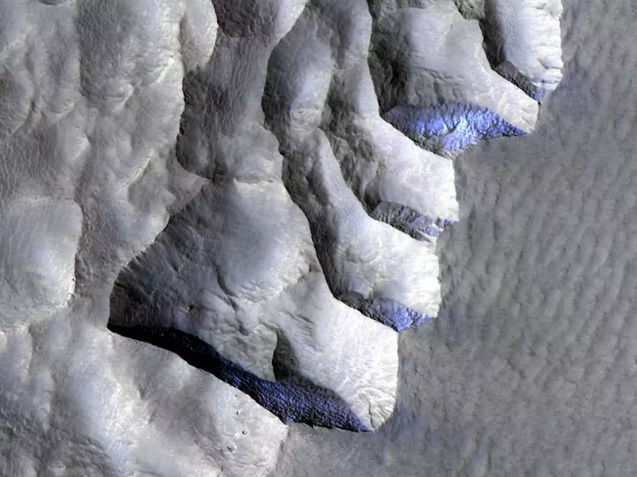 Ice Peeks out of a Cliffside on Mars - Universe Today