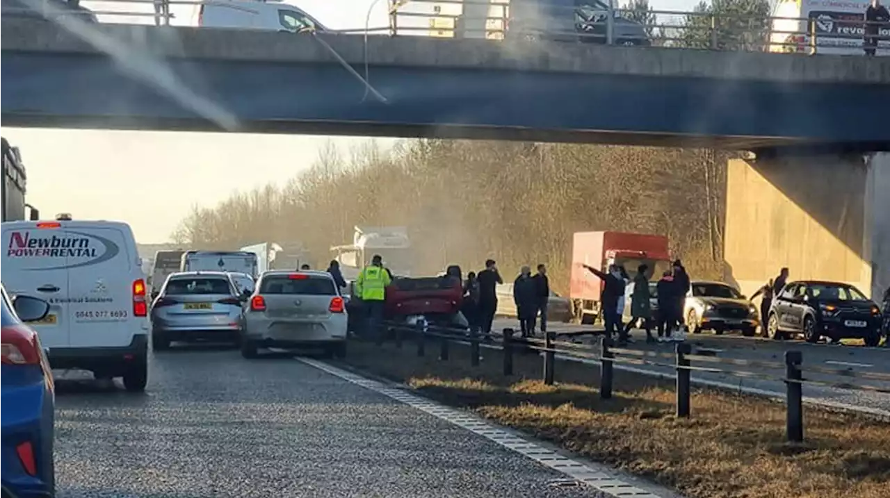 Car Falls From Bridge On To Busy Motorway