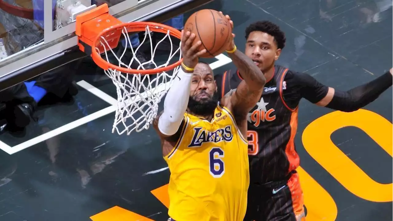 James scores 29, plays center as Lakers rally past Magic