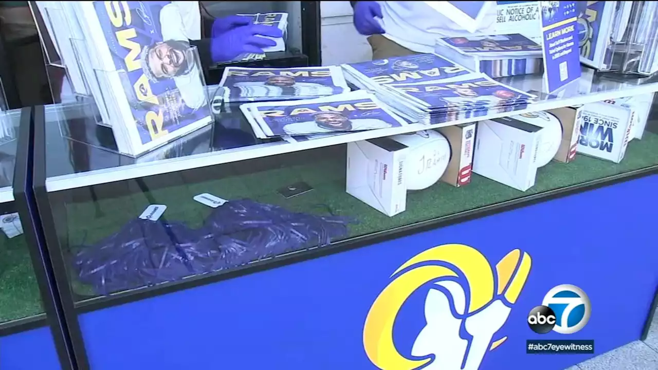 Rams hand out free goodies at pop-up newsstands ahead of Sunday playoff game against Buccaneers