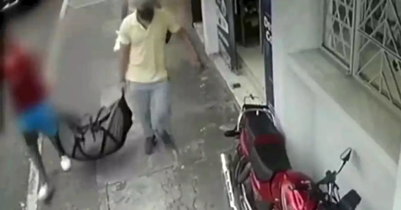 Chilling CCTV of men carrying bag ‘with woman’s body stuffed inside’ in street