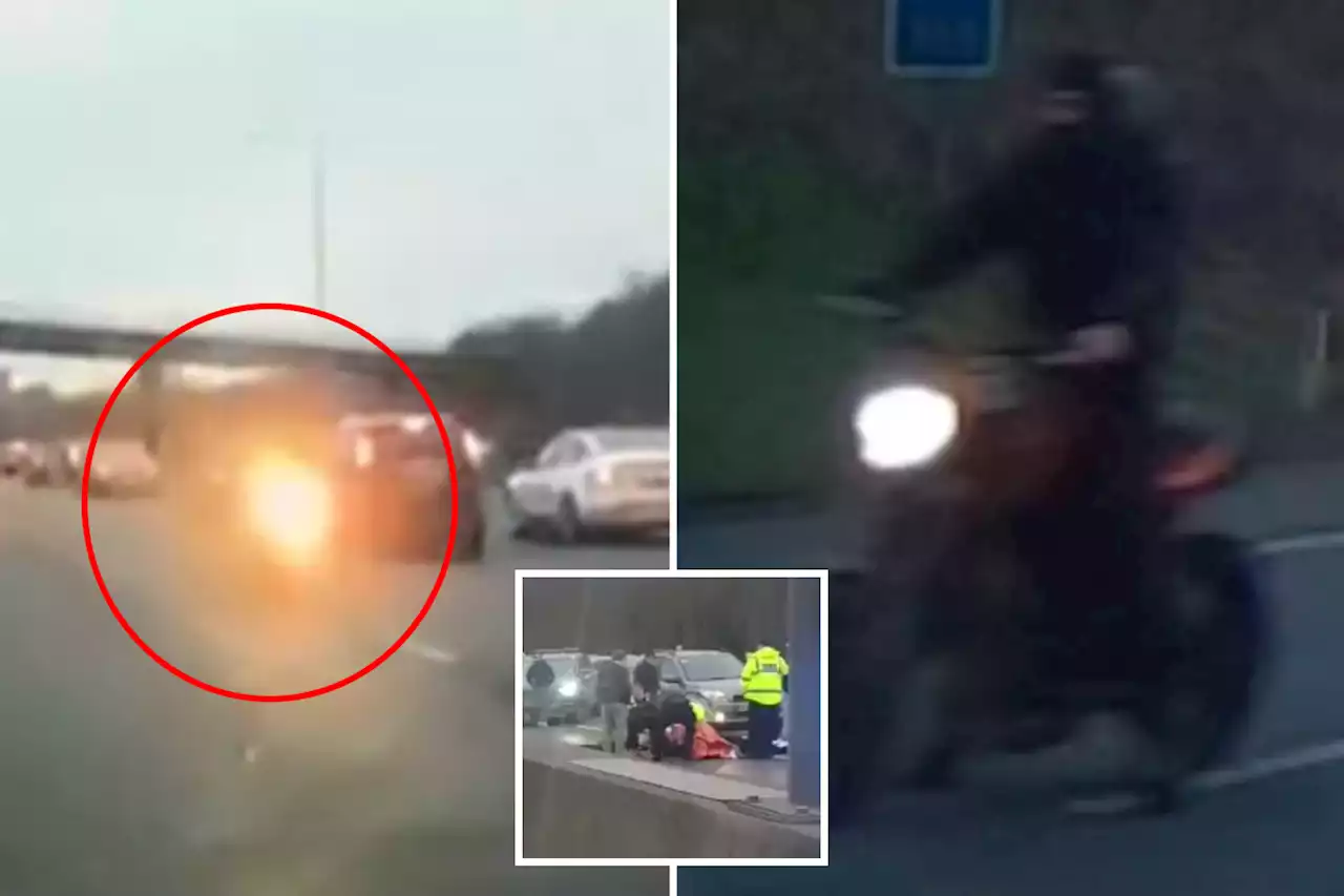 Biker speeds WRONG WAY down busy M25 before smashing into and injuring cop