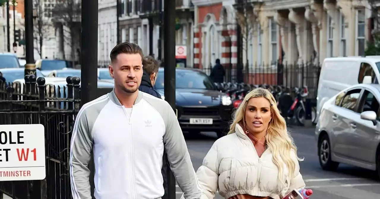 Katie Price and Carl Woods hold hands at fertility clinic amid pregnancy rumours