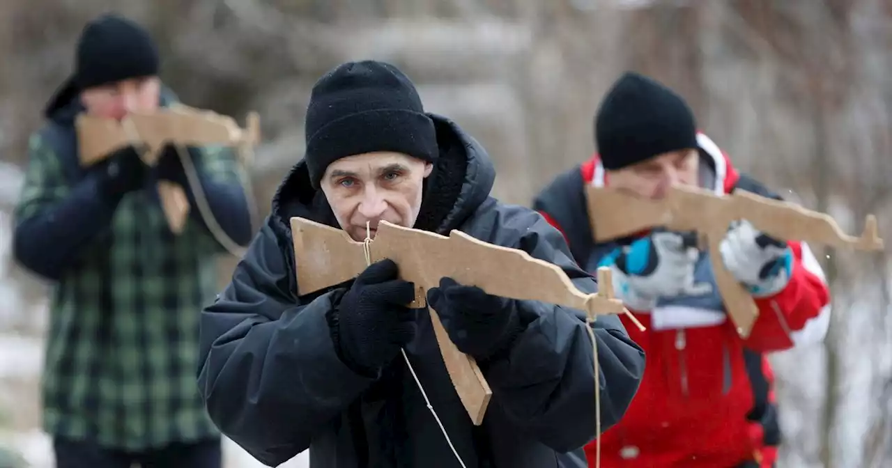 Ukrainian soldiers train with wooden assault rifles amid Russia invasion fears