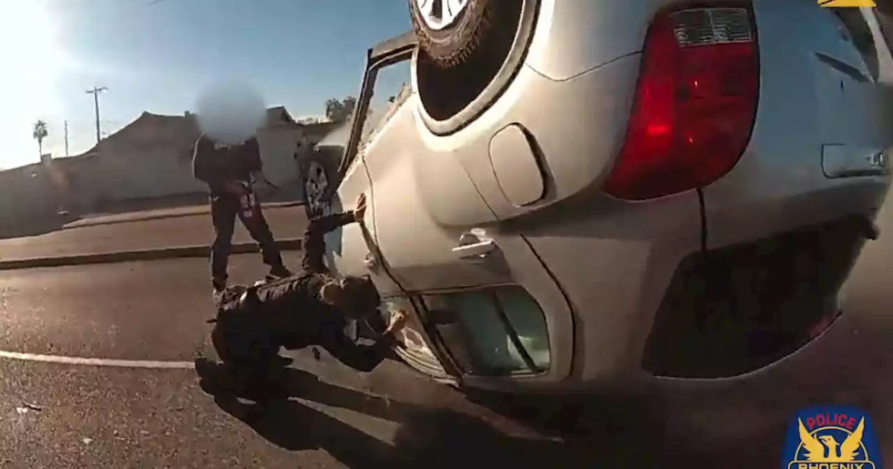 Phoenix officers save man from burning car