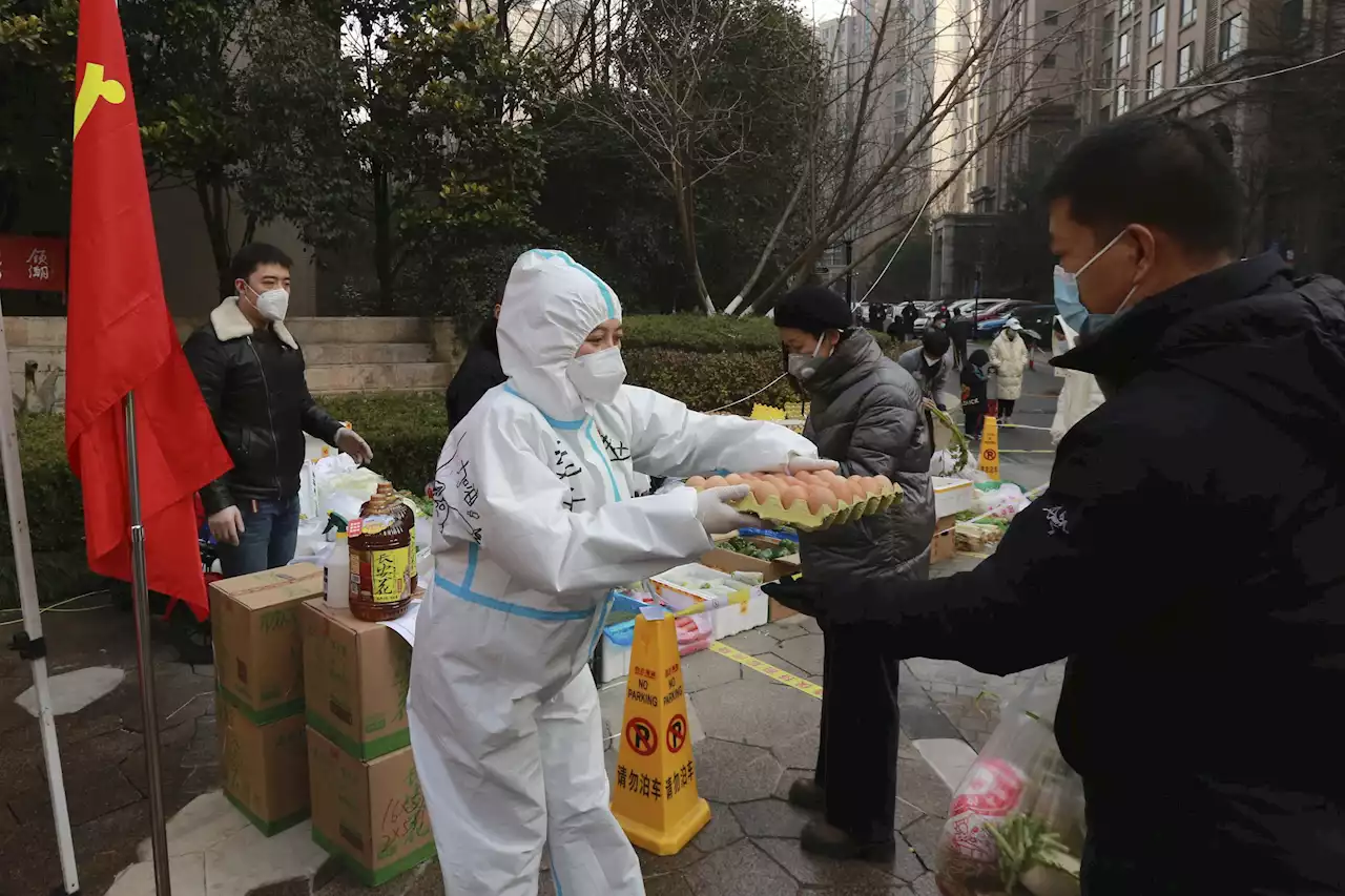 Conditions hard for 13 million under China virus lockdown | AP News