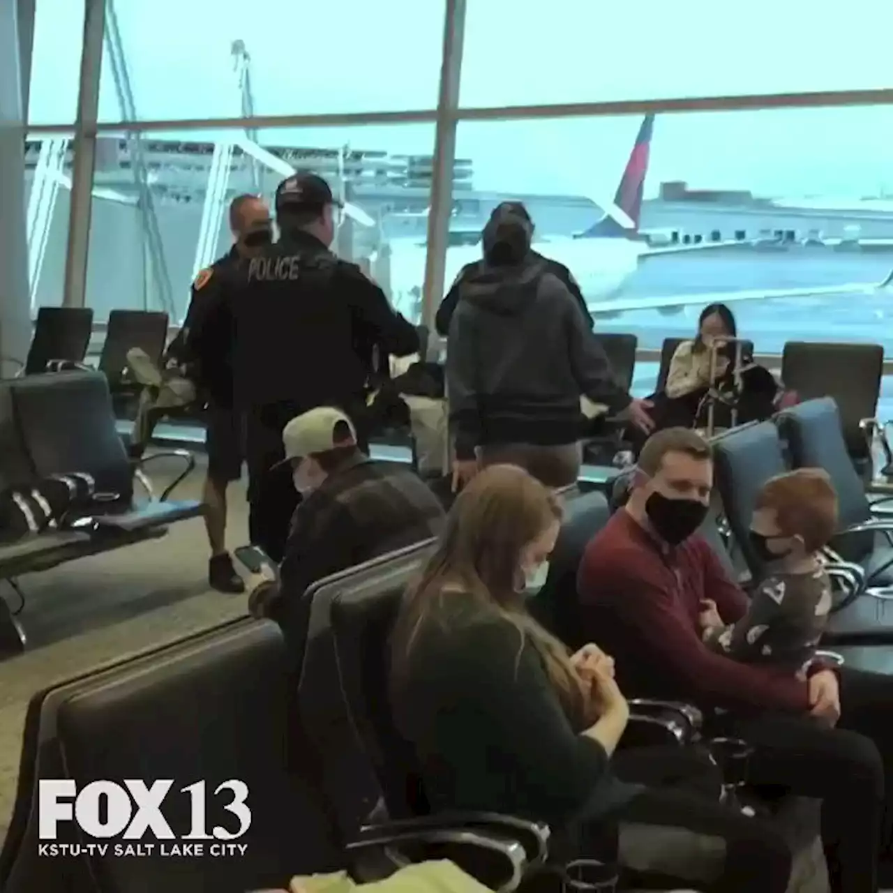 Woman accused of kicking officer yells racist language during SLC Airport meltdown