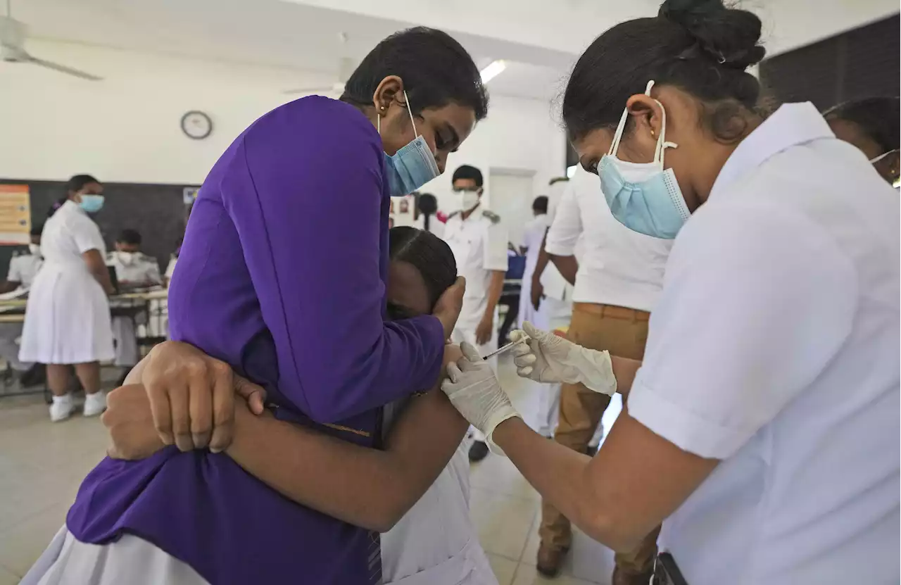 Sri Lanka vaccinates children as doctors warn of COVID surge | AP News