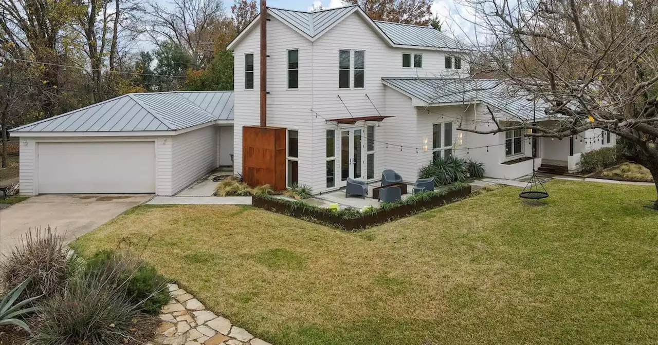 This home in Old Lake Highlands has two rock climbing walls inside