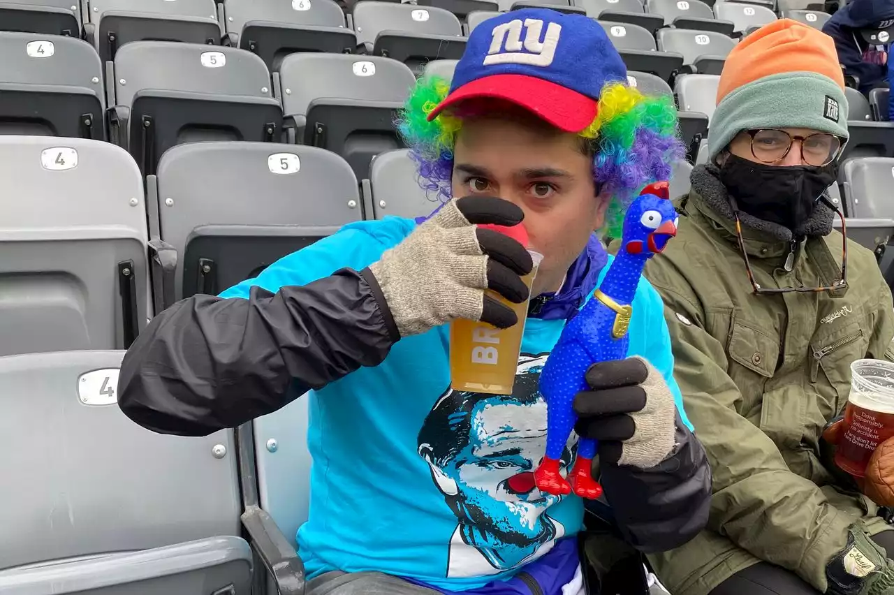 Scenes from Dave Gettleman’s last game as Giants GM: Hugs, kisses, heckling John Mara and a fan dressed like a clown (PHOTOS, VIDEO)