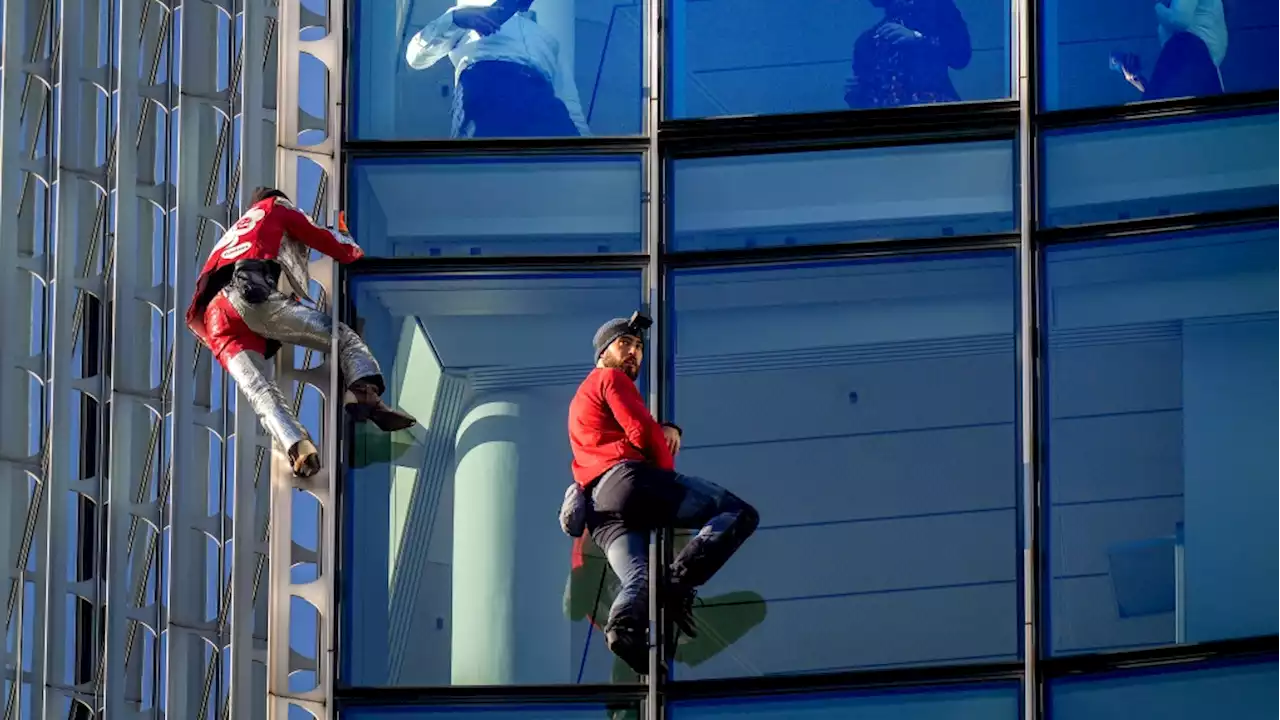 'French Spiderman' climbs first skyscraper with son in Barcelona