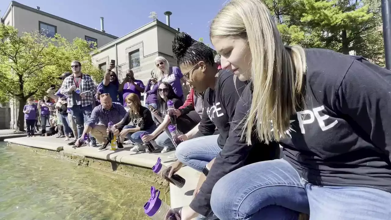 'People are really struggling': Downtown Canal dyed purple to recognize National Recovery Day