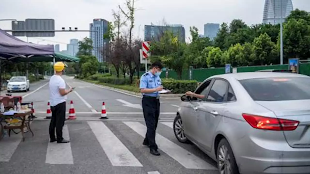 China reimposes lockdowns as Covid surges after weeklong holiday
