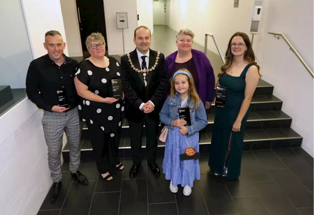 Former foster carers receive top award for charity work