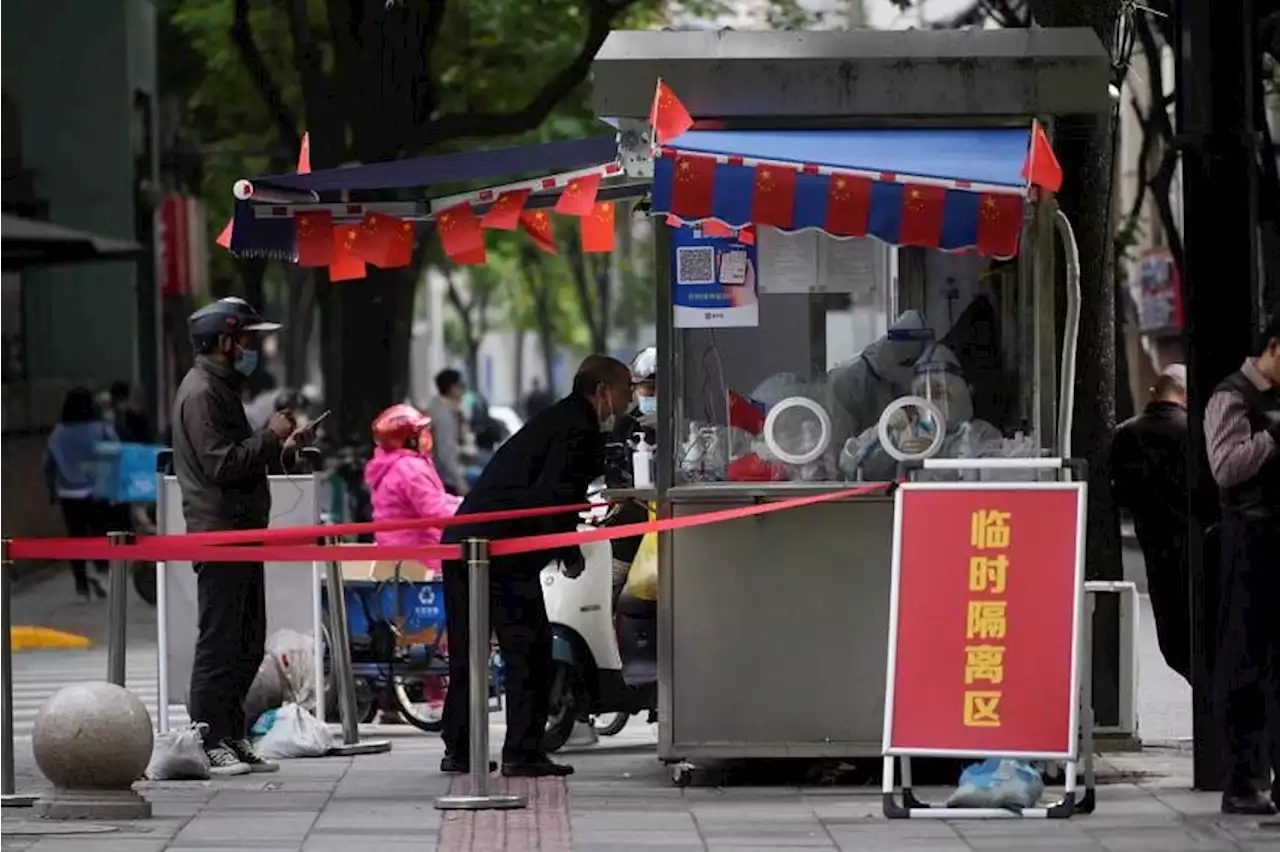 China reports fewer Covid-19 cases overall but Shanghai numbers rise
