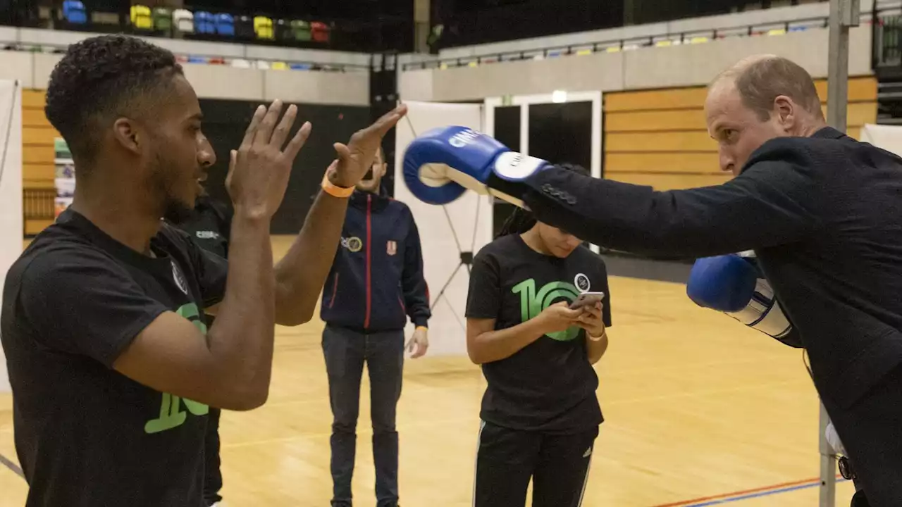 The Punch of Wales! William pulls on gloves and spars with boxer