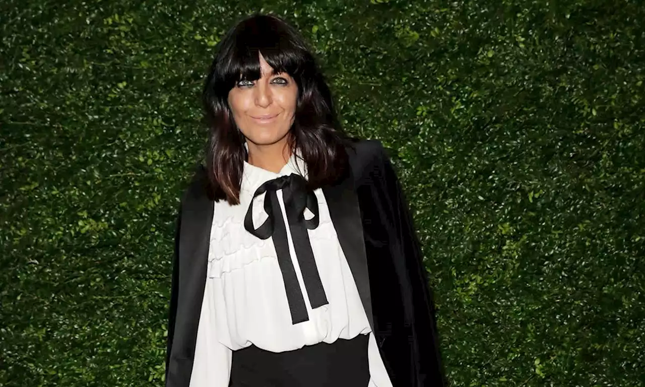 Claudia Winkleman looks sensational in slinky black dress and silver boots