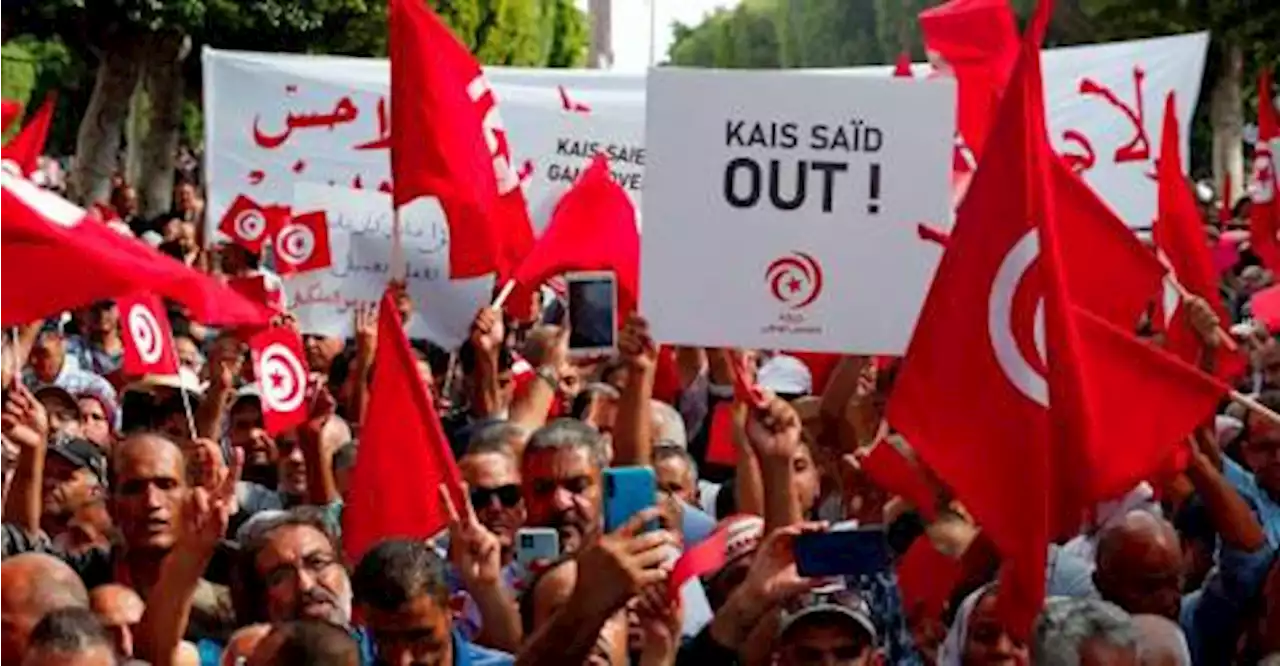 Thousands from rival Tunisian parties protest against president