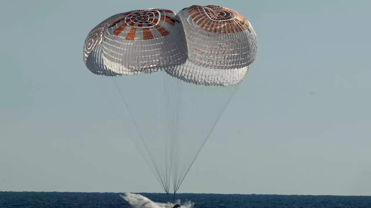 SpaceX ferries astronauts back to Earth after half-year away