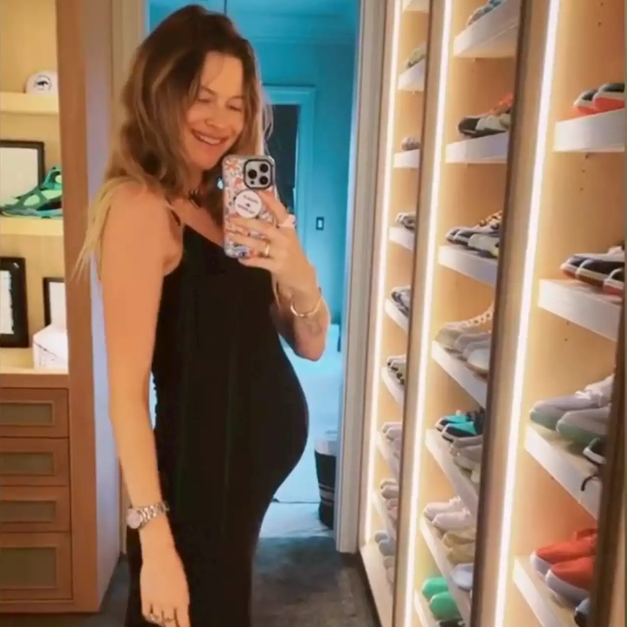 Behati Prinsloo Is All Smiles As She Shows Off Her Baby Bump After Adam Levine DM Scandal - E! Online