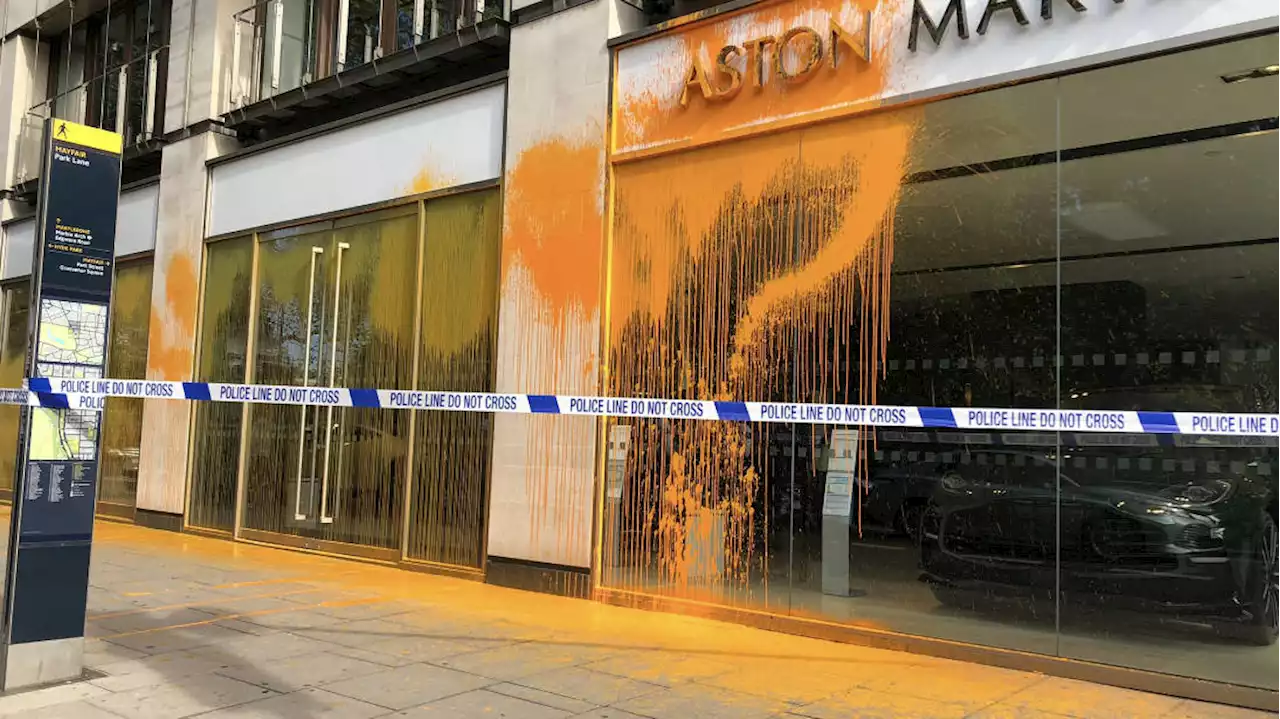 Eco activists Just Stop oil cover Aston Martin dealership with orange paint in latest London protest