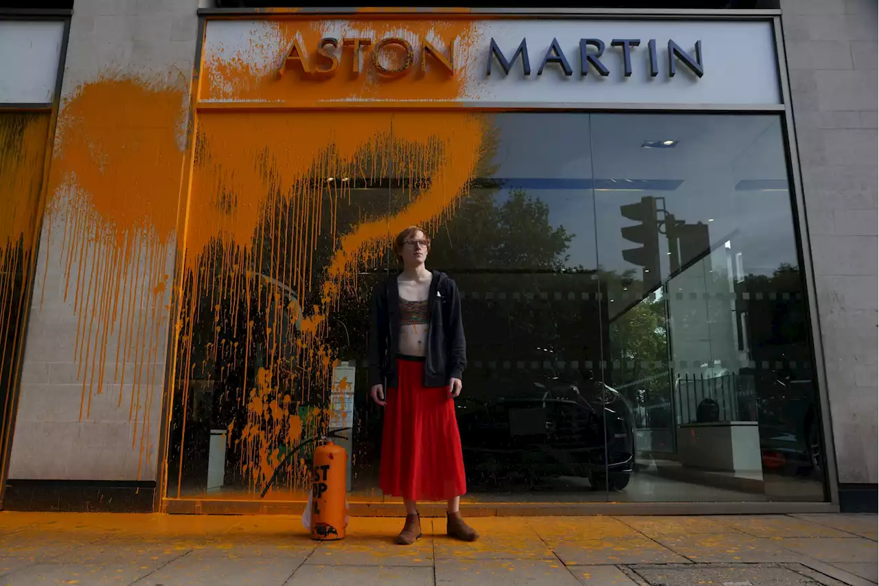 Just Stop Oil protesters spray Aston Martin showroom with orange paint in London's Park Lane