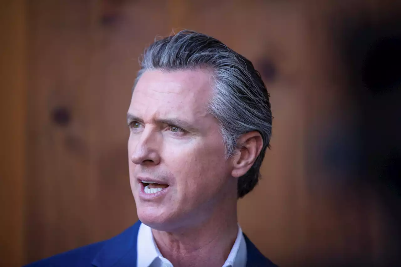 Why was Newsom absent during Biden visit?