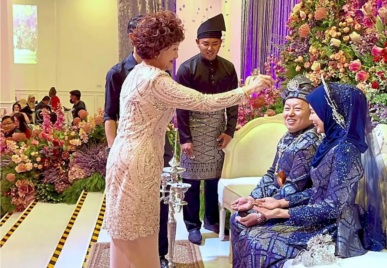 Chinese pair, Malay wedding