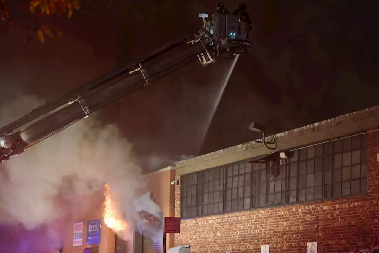 Massive four-alarm fire in Queens guts warehouse, leaves two firefighters injured | amNewYork