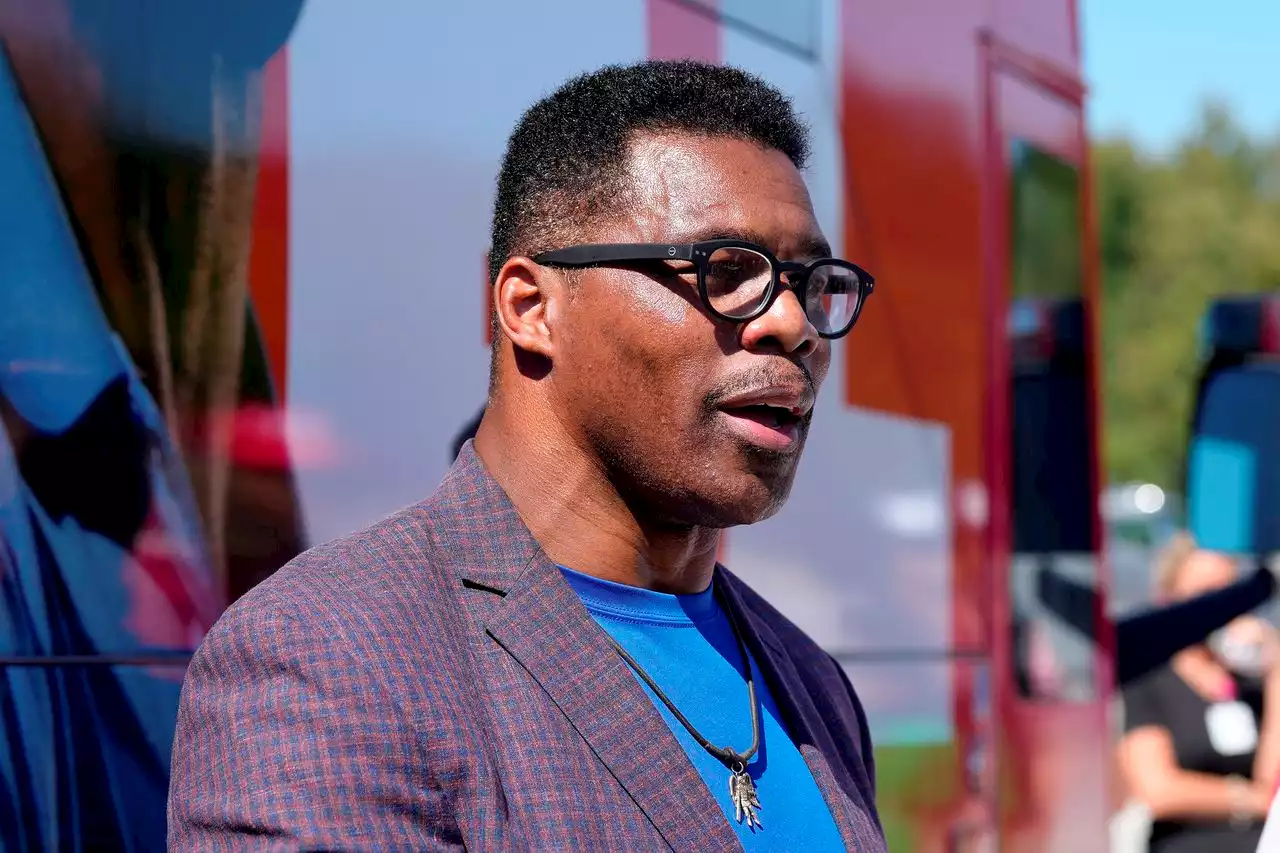 Herschel Walker flashes ‘prop’ badge during debate: ‘I am work with many police officers’