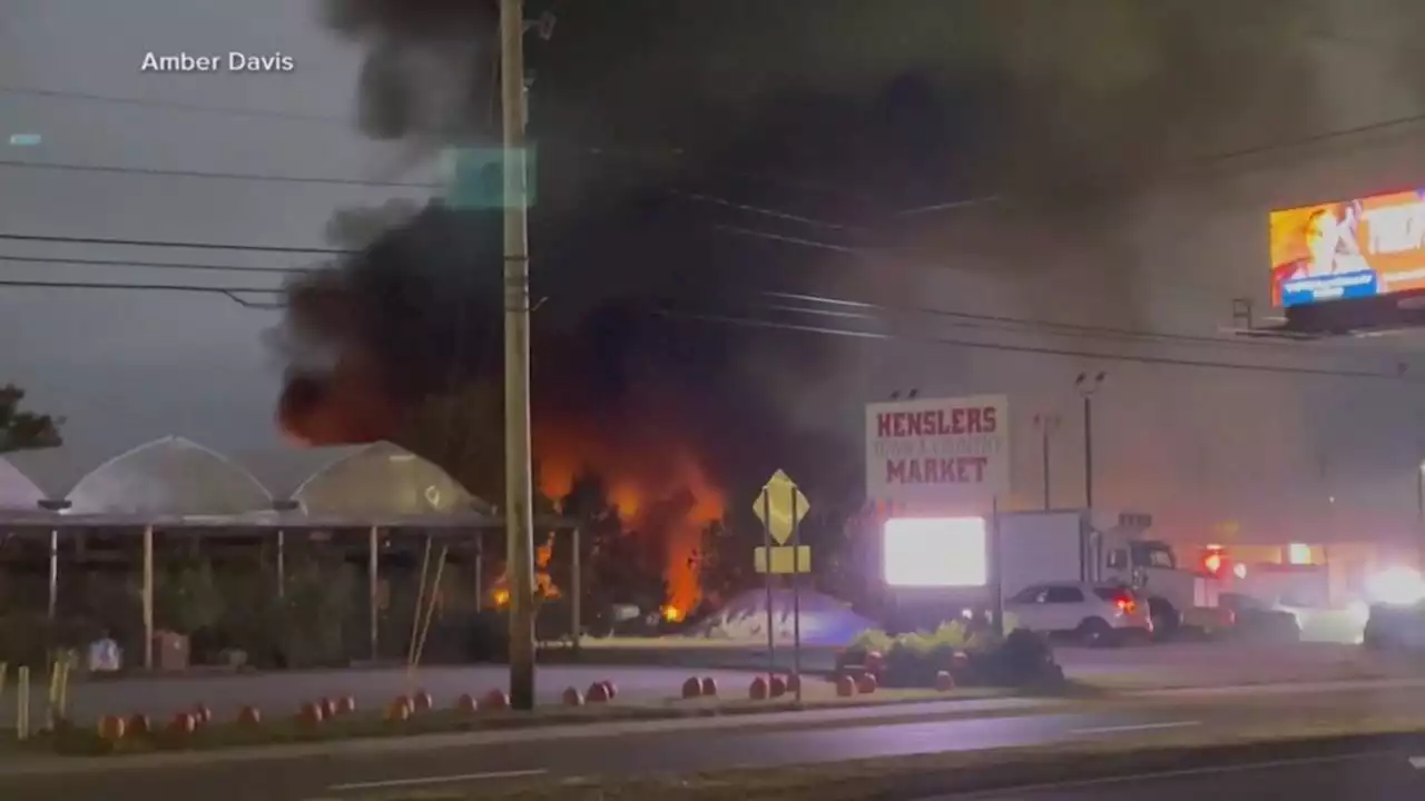 2 killed when small plane crashes into Ohio car dealership