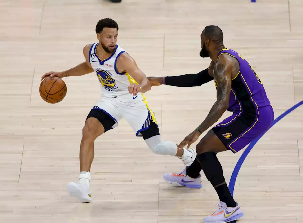 Warriors begin title defense with win over Lakers