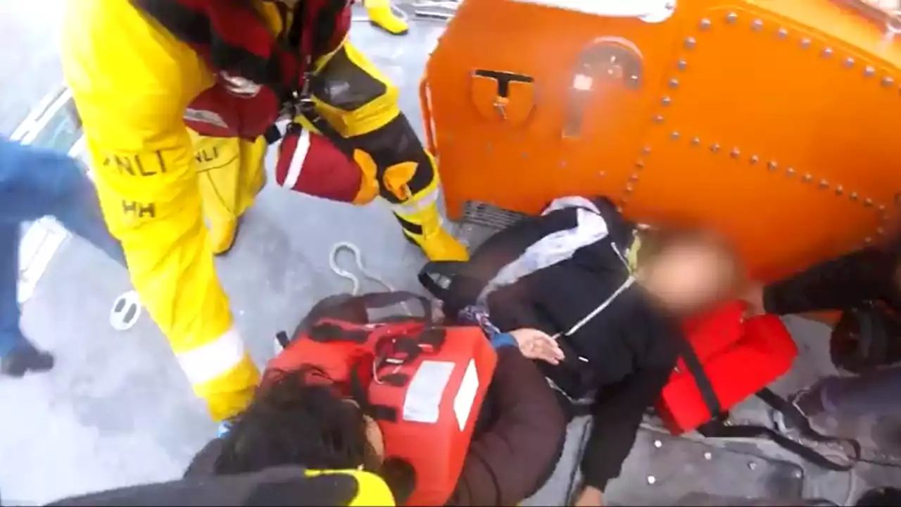 Dramatic footage shows RNLI lifeboat crew pulling family from stricken dinghy in the Channel