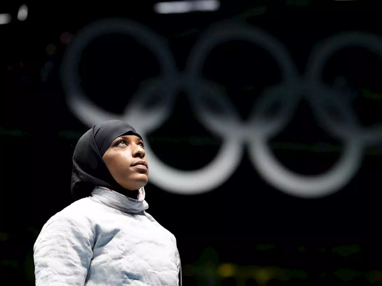 A New Jersey teacher accused of pulling a student's hijab sues an Olympic fencer