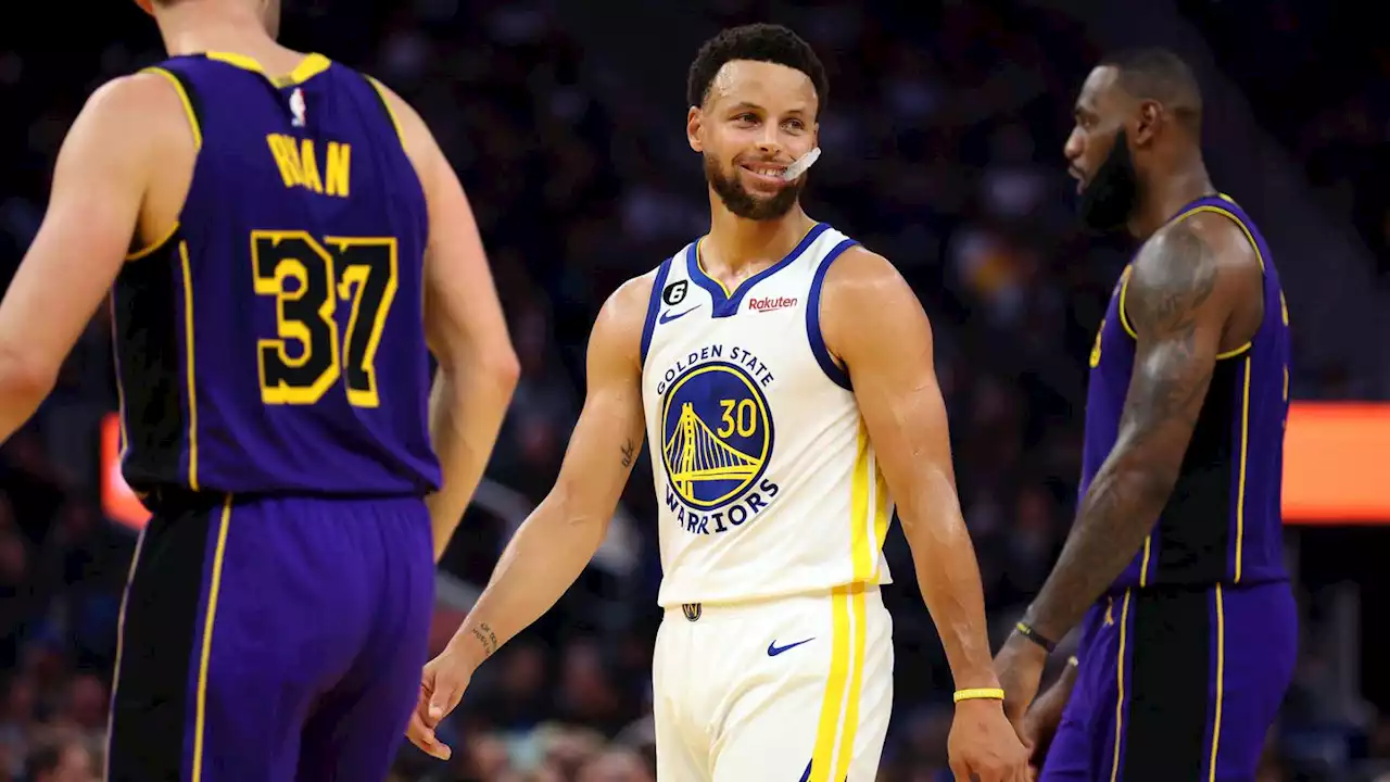 Steph Curry scores 33 as Golden State Warriors open title defense with win over Los Angeles Lakers; LeBron James scores 31