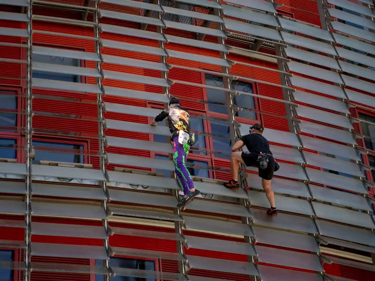 'French Spiderman' climbs first skyscraper with son in Barcelona