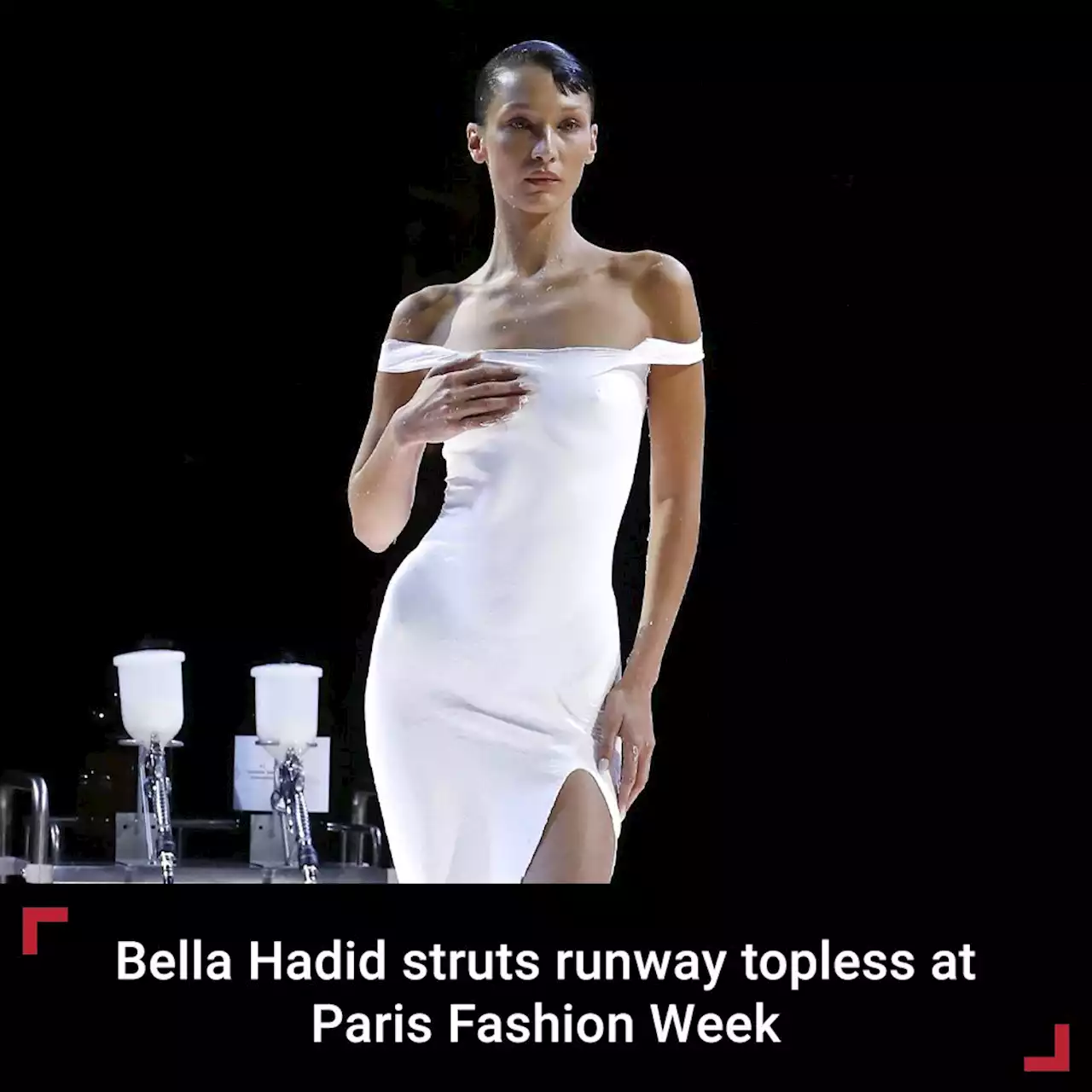 Bella Hadid struts runway topless, then gets white dress spray-painted for Paris Fashion Week