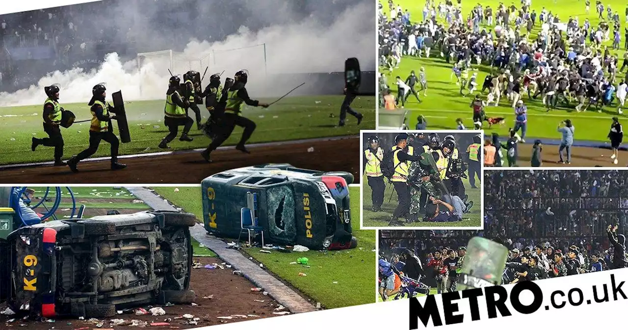 At least 174 football fans dead after stampede and riots on pitch