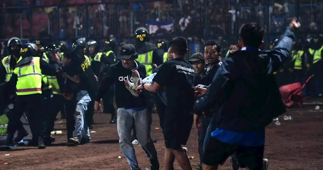 Stampede triggered by tear gas leaves 125 dead after Indonesia soccer match