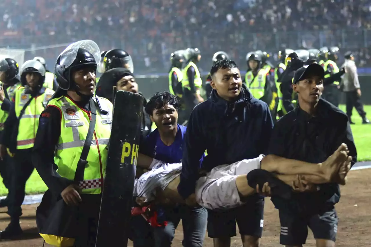 At least 125 dead after tear gas triggers crush at Indonesian soccer match