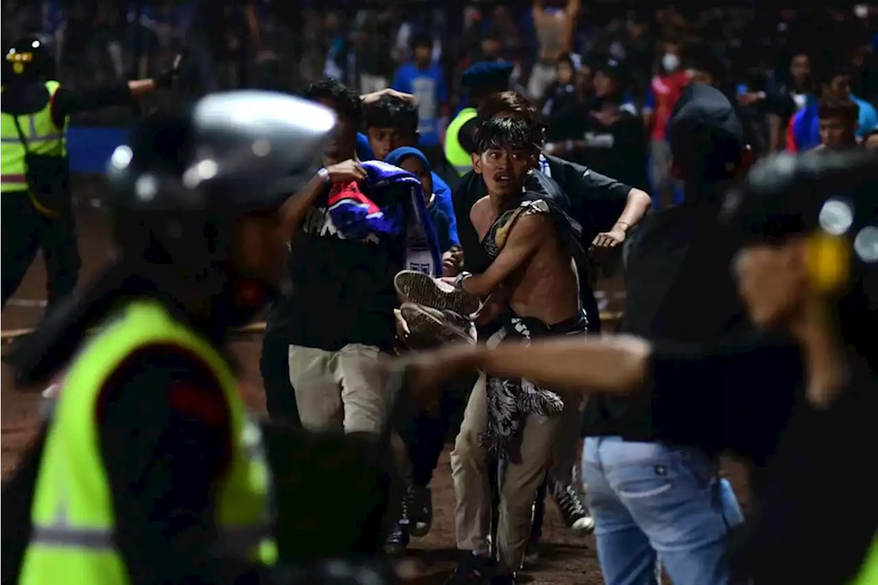 Stampede at Indonesia soccer game kills 125, officials say