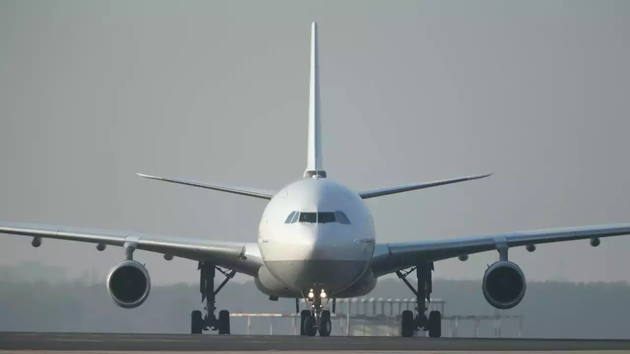 Armed police storm plane and arrest three men on suspicion of bomb hoax at Stansted