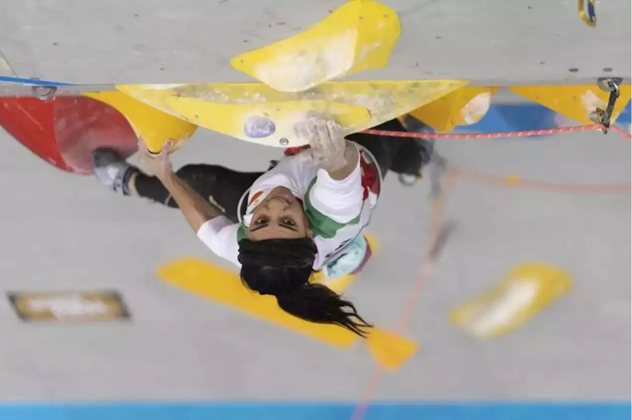 Iranian rock climber who competed in South Korea without hijab returns ...