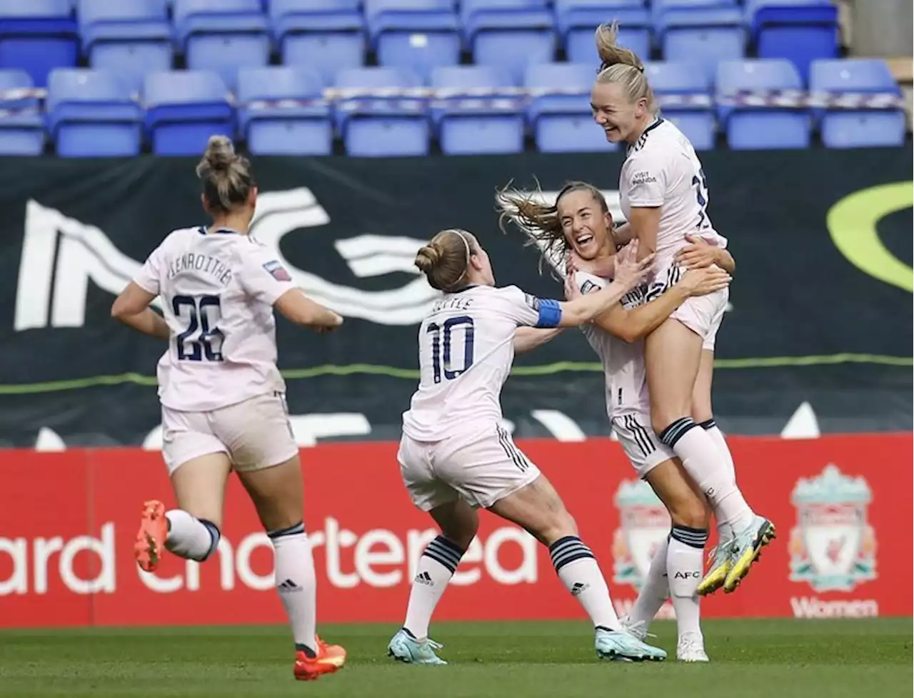 Soccer-Arsenal go top of WSL with 2-0 win over Liverpool