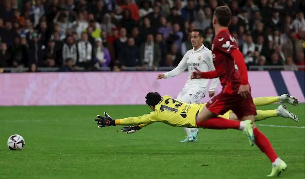 Soccer-Real Madrid score two late goals to win 3-1 against Sevilla