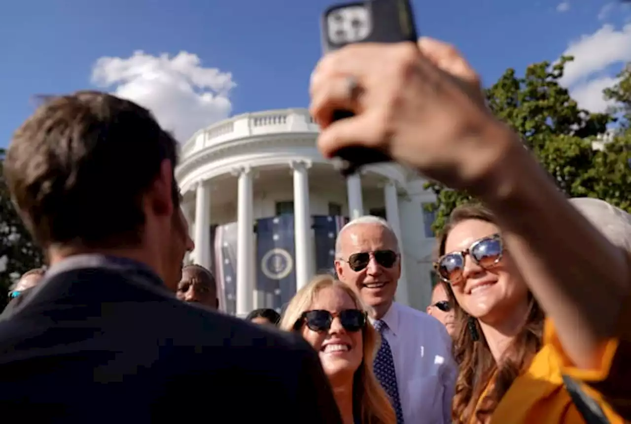 One hug and one selfie at a time, Biden's mission to connect